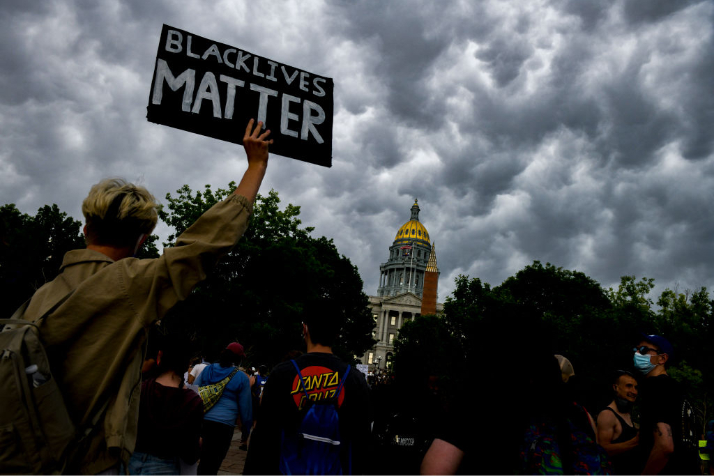People protest next to the Colorado State Capitol on June 6, 2020, in Denver, Colorado.