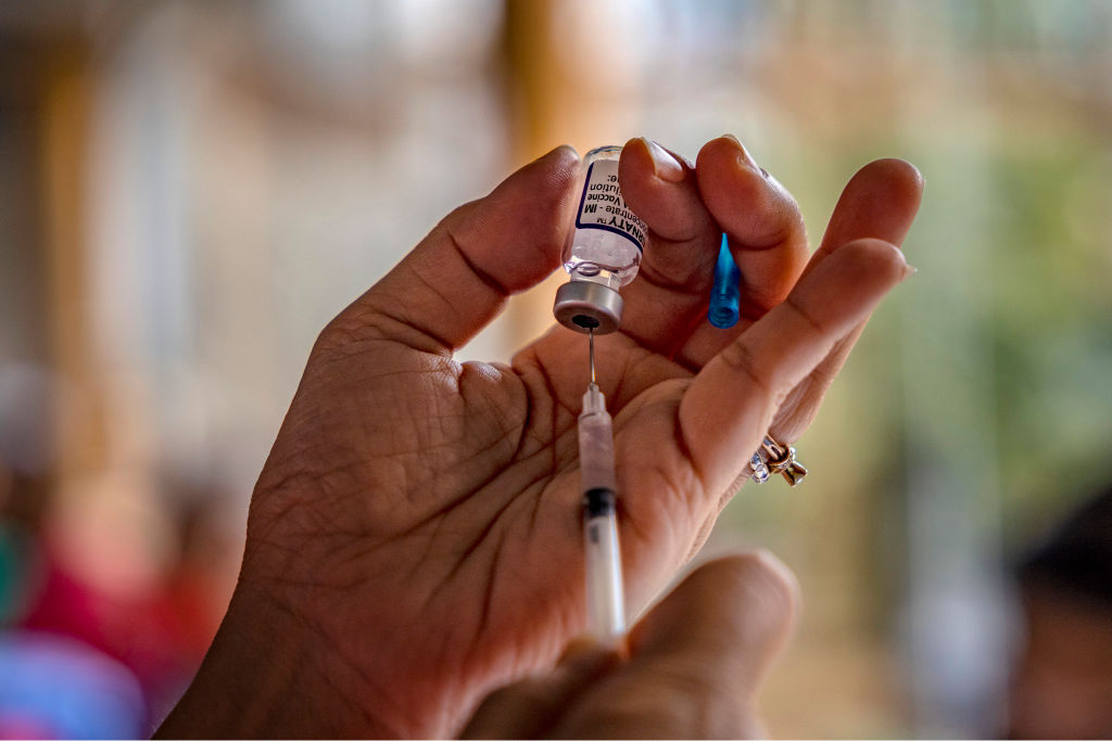 A healthcare worker prepares a dose of Pfizer BioNTech COVID-19 vaccine.