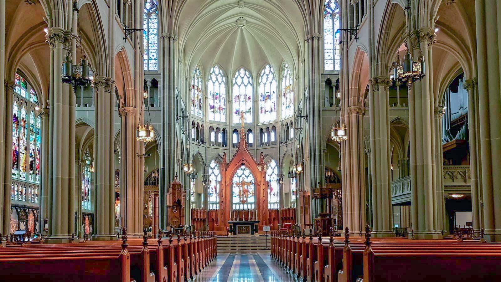 Framed by huge columns, the main nave soars to 85 feet above the church's marble and hand-carved wood altar.