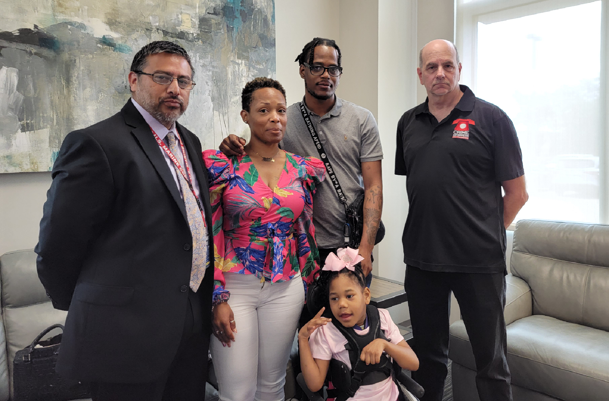 Disha Allens family with CrimeStoppers Houston Andy Kahan and HPD detective
